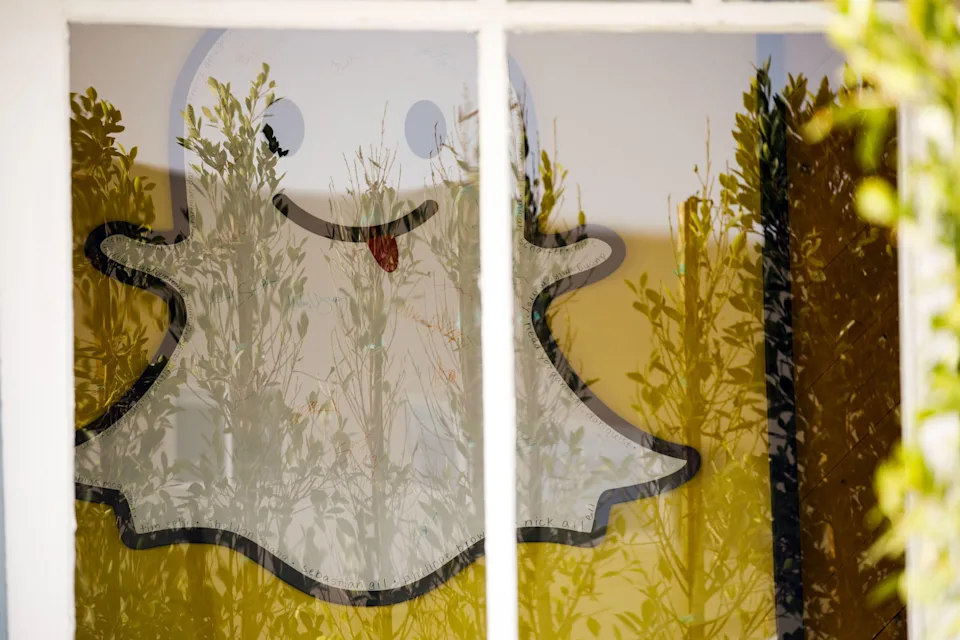 Snapchat logo seen through a window