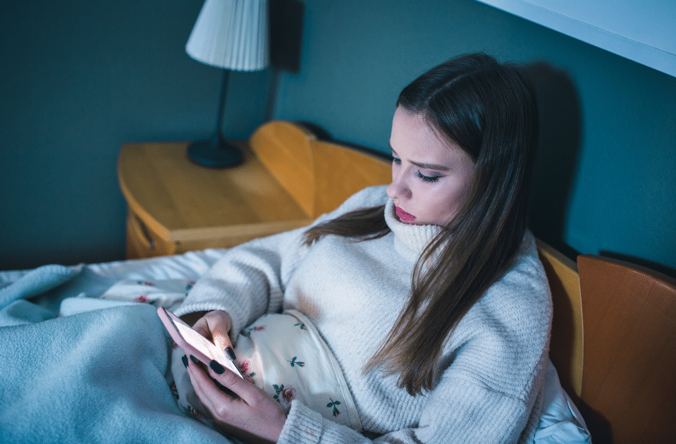 a teen using her phone to access social media